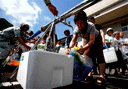 Japan struggles to restore water to flood-hit towns