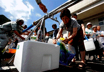 Japan struggles to restore water to flood-hit towns
