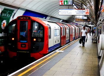Mother, child hide as London Tube train passes over them