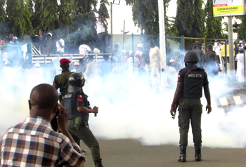 Photos: Saraki, others  teargassed during protest in Abuja