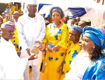 From left—Prince Rotimi Ogunleye, Lagos State Commissioner for Physical Planning & Urban Development, representing Governor Akinwunmi Ambode of Lagos State, presenting a Merit Award plaque to High Chief Owolabi Salis, Alliance for Democracy, AD, Lagos State governorship candidate; his wife, Olabisi, and other dignitaries, during the presentation of the award to Salis by Ikorodu-Oga Development Association, IKODASS, at the grand finale of Ikorodu Day celebration, in Lagos.