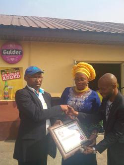 Fortune club president, chairman board of trustees receive gold merit award