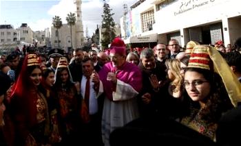 Pilgrims gather in Bethlehem to celebrate Christmas Eve