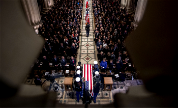Reverence, grace as leaders gather for Bush funeral