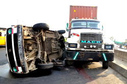3 cheat death as tomatoes-laden trailer crashes in Minna