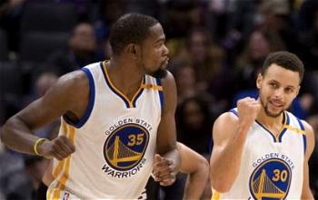 Curry, Durant lift Warriors over Clippers in NBA thriller