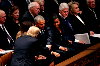 George W. Bush has sweet exchange with Michelle Obama at father’s funeral