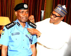 Photos: Idris presents new IGP Muhammed Abubakar Adamu