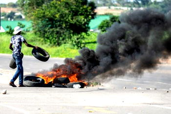 Zimbabwean protesters burn tyres, block roads over fuel price hike