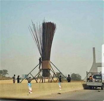 Photo: Nigerians react to giant broom erected at Abuja’s city gate