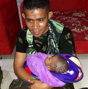 Baby reunited with dad as Indonesia flood death toll hits 79