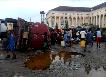 Residents in Imo, fall on each other to scoop Kerosene from a fallen tanker