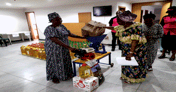 RCCG splashes various gifts on widows at monthly fellowship