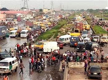 [PHOTOS] Lagos-Badagry Expressway: Many trapped as heavy downpour, failed road result in lockdown