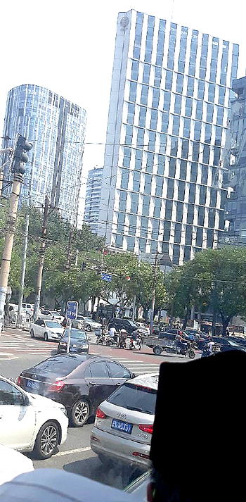 In warm embrace of Chinese skyscrapers, noodles, hospitality