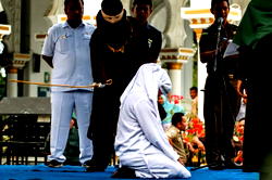 Couples whipped for public display of affection in Indonesia