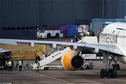Thomas Cook passengers applaud staff after final flight lands in UK