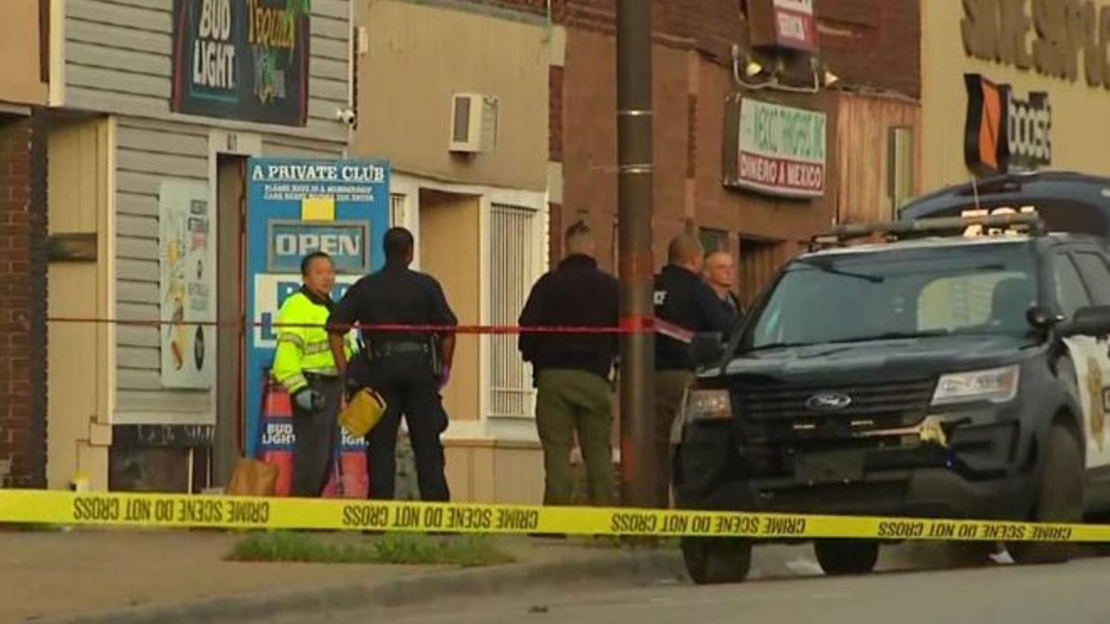 Gunman on run after four shot dead at bar