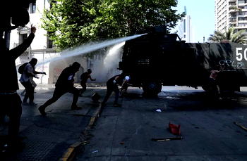 At least three dead in fires amid Chilean riots, flights disrupted