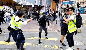 Hong Kong police shoots protester at point-blank range while activists set another man on fire