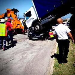 Woman survives after lorry lands on her car in South Africa
