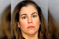 Woman who called 911 to report dead body charged with her murder