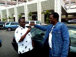 Bishop Sam Zuga gives brand New Peugeot 406 to Catholic priest