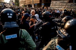 Fire and petrol bombs after ‘generally peaceful’ Hong Kong march, police say