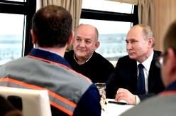 Putin takes first train across Crimea bridge