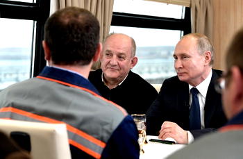 Putin takes first train across Crimea bridge
