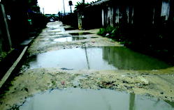 BAD ROADS:  We park our cars, trek home, Ekpan residents grumble