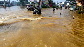 66 killed in Indonesian floods as officials warn of more heavy rain