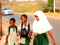 Back to school: Pupils walk long distance after ban of tricycle (Photos)