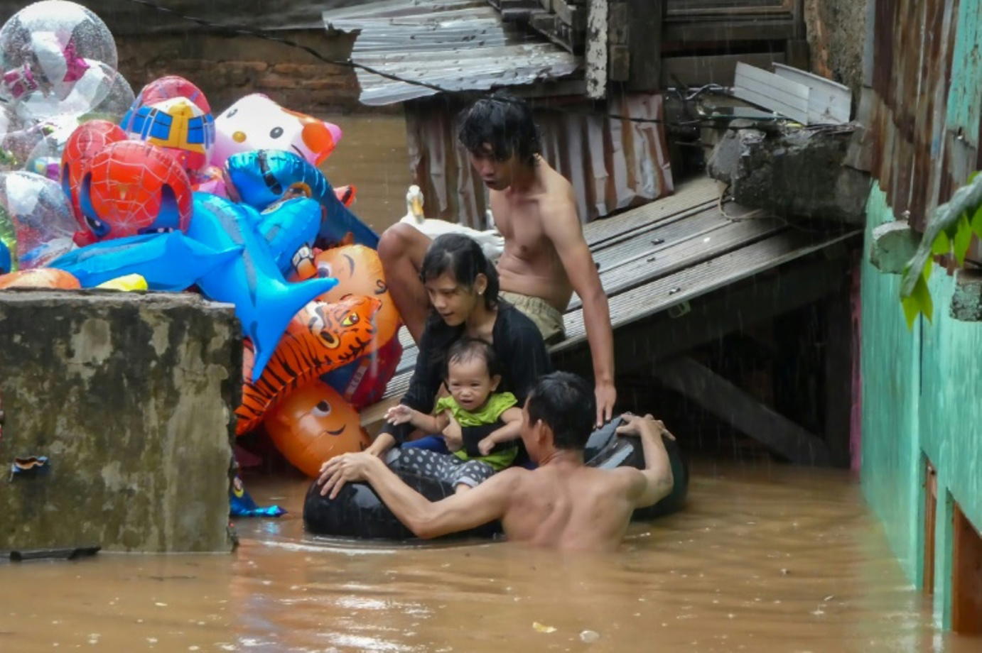 Nine dead after Indonesian capital hit by New Year flooding