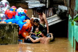 Nine dead after Indonesian capital hit by New Year flooding