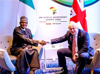 Buhari shakes hand with Boris Johnson, lists achievements so far
