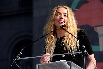 Actress Amber Heard admits hitting former husband Johnny Depp