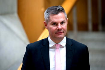 Scotland’s finance minister quits over messages to boy