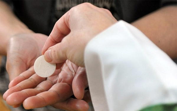Breaking: Catholics to receive communion on the palm, as church bans handshake in Lagos over virus