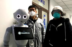Coronavirus hospital ward staffed by robots opens in Wuhan to protect medics