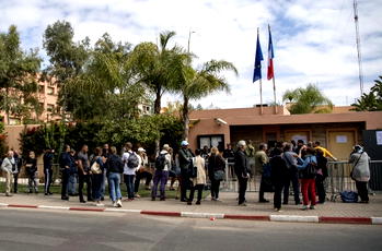 Stranded tourists in Morocco scramble to leave