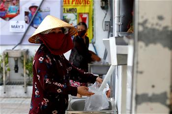 ‘Rice ATM’ feeds Vietnam’s poor during lockdown