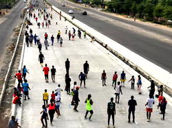Social distancing: Lagosians on Gbagada expressway keeping fit amidst lockdown