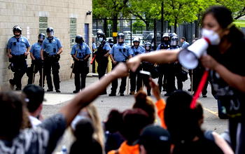 Mayor of Minneapolis calls for criminal charges against officer who put knee on man’s neck