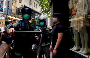 Protesters mass in Hong Kong as anthem law is debated
