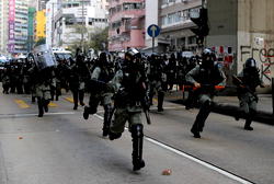 Hong Kong police stamp out national anthem law protests