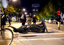 Crowds tear down statues, attack Wisconsin state senator