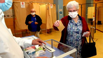 Face masks and votes: French turnout in low numbers for delayed local elections