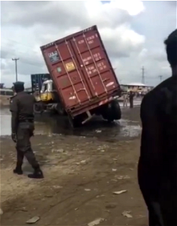 CAPTURED: Moment container-laden truck falls at Mile 2, Lagos