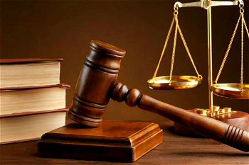 2 men in court for allegedly stealing their roommate’s cell phone, N15,000